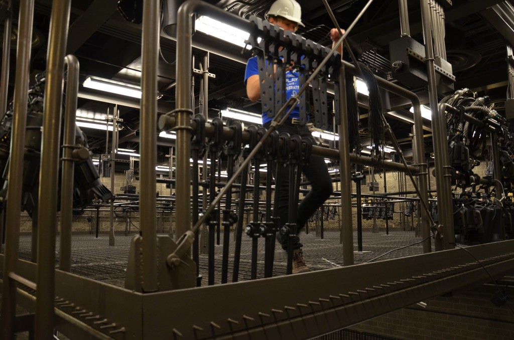 student stands near the edge of the Black Box tension grid