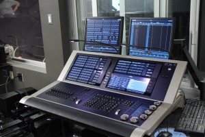 Large EOS lighting console with four monitors in the Black Box booth