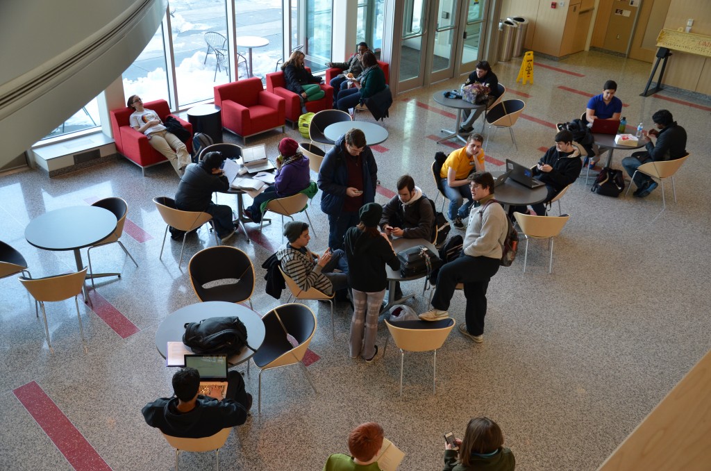 Many students walk around the PAHB lobby